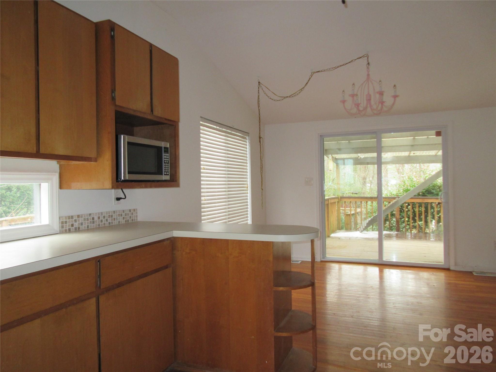 31 Ford Ridge Lane Columbus, NC 28722 - Photo 2 of 21 a kitchen with stainless steel appliances a sink a stove cabinets and a window