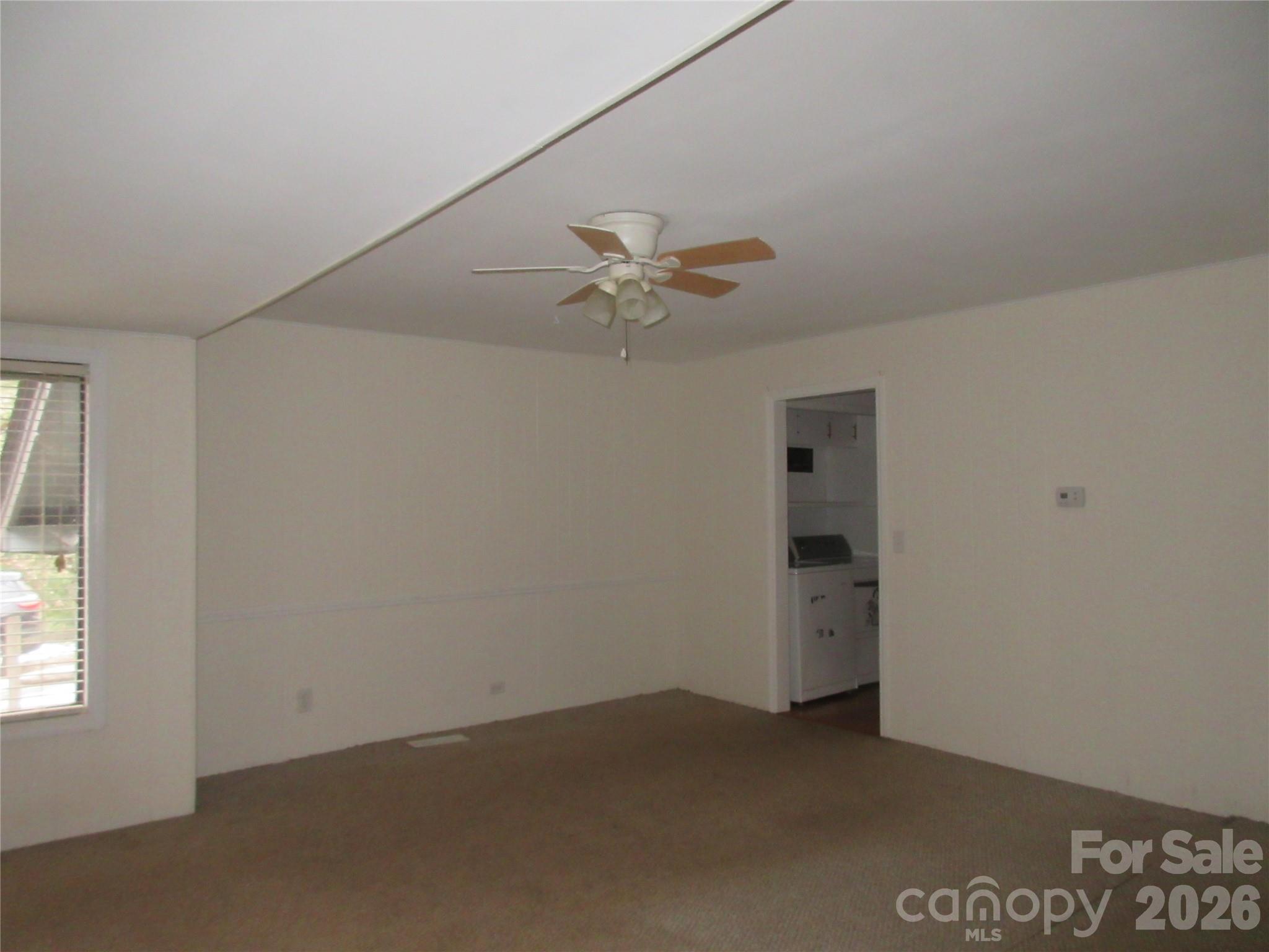 31 Ford Ridge Lane Columbus, NC 28722 - Photo 8 of 21 an empty room with a window and a fan