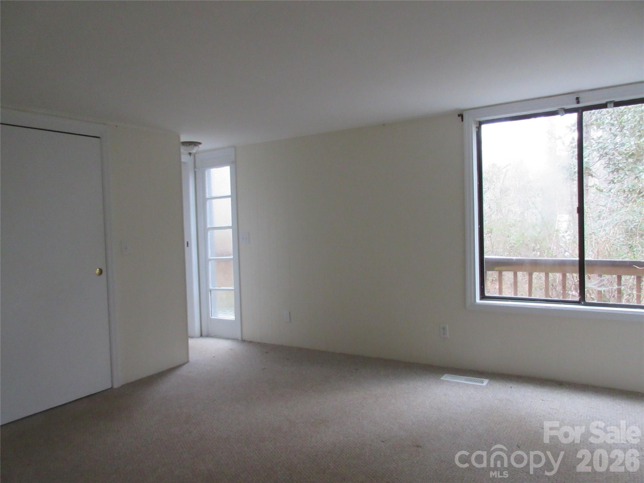 31 Ford Ridge Lane Columbus, NC 28722 - Photo 9 of 21 a view of an empty room with a window
