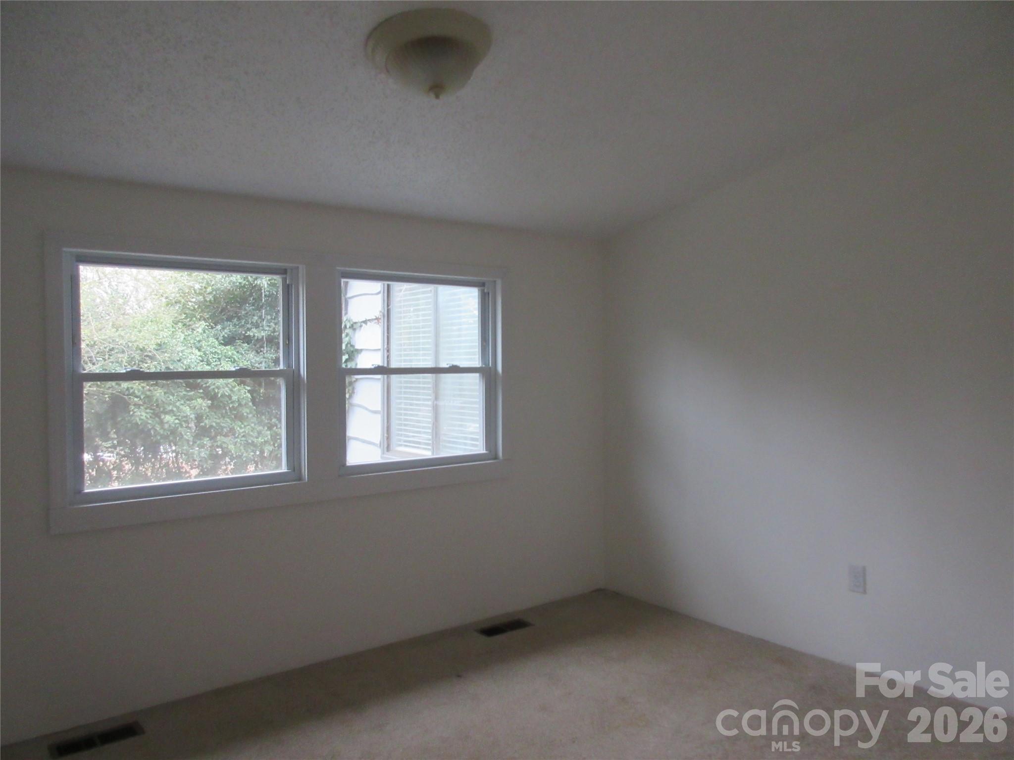 31 Ford Ridge Lane Columbus, NC 28722 - Photo 10 of 21 an empty room with a window