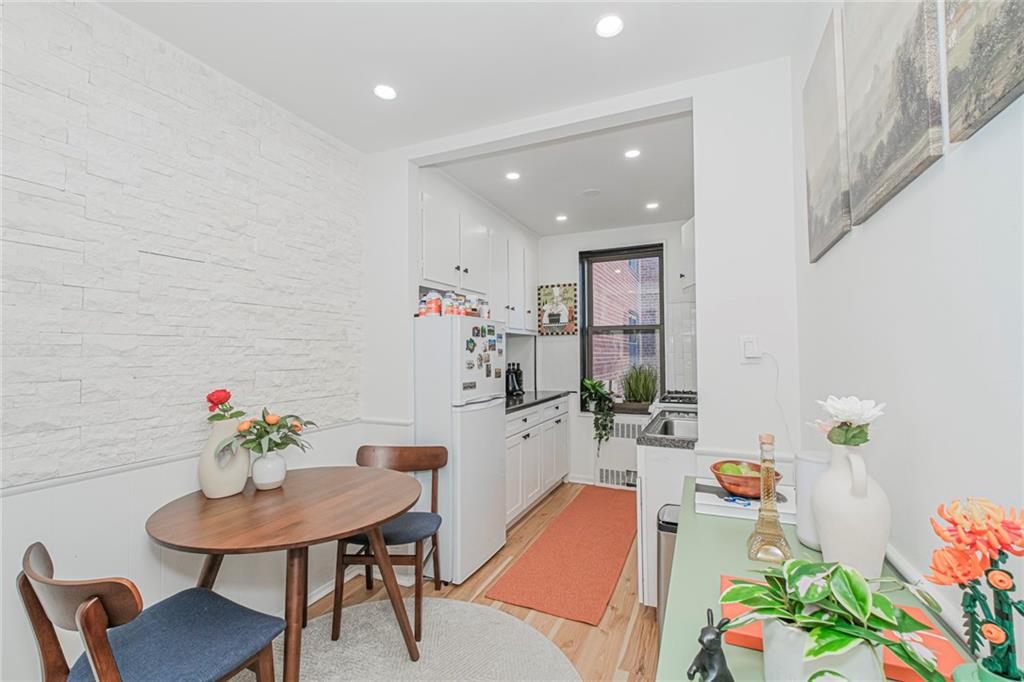 2140 Knapp Street, Unit 5H Brooklyn, NY 11229 - Photo 11 of 21 a very nice looking dining room with a table and chairs in it