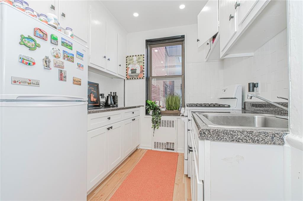 2140 Knapp Street, Unit 5H Brooklyn, NY 11229 - Photo 14 of 21 a kitchen with stainless steel appliances granite countertop a sink and a granite counter tops