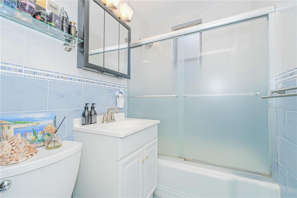 2140 Knapp Street, Unit 5H Brooklyn, NY 11229 - Photo 18 of 21 a bathroom with a sink toilet and shower