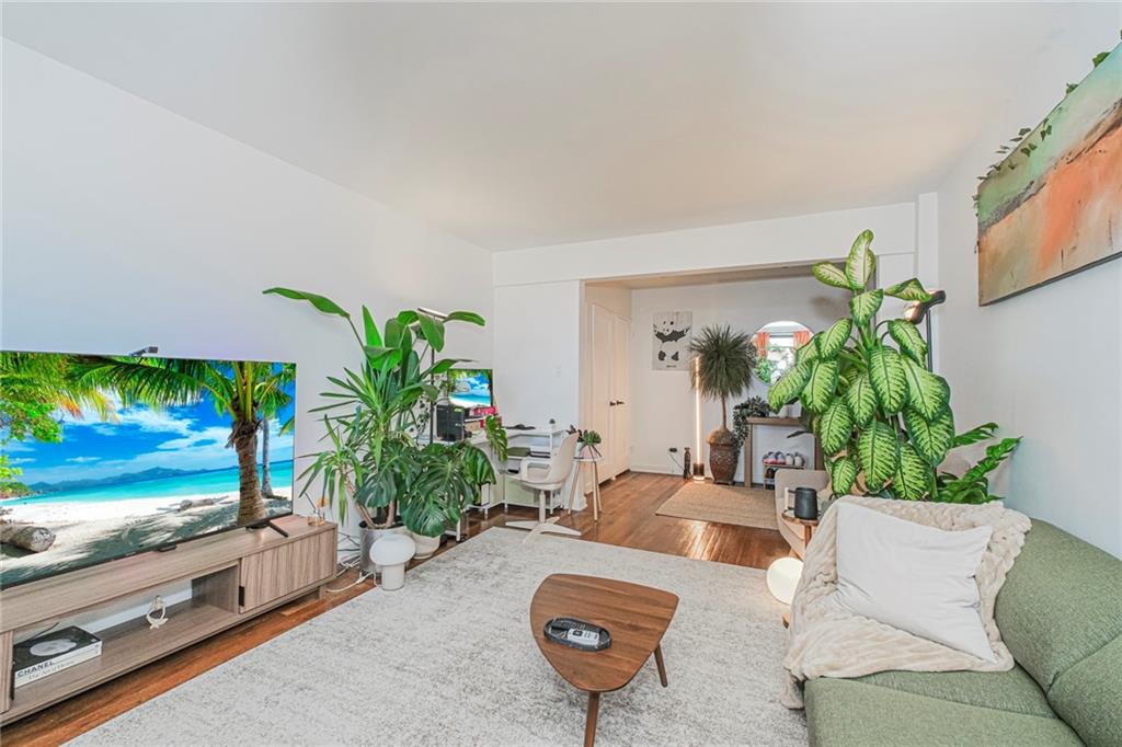 2140 Knapp Street, Unit 5H Brooklyn, NY 11229 - Photo 4 of 21 a living room with furniture and a flat screen tv