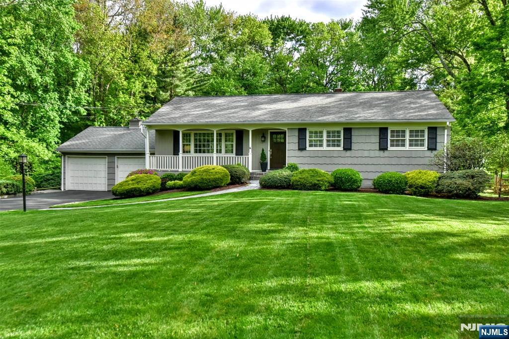 60 Dimmig Road Upper Saddle River, NJ 07458 - Photo 39 of 40 a view of a house with a garden