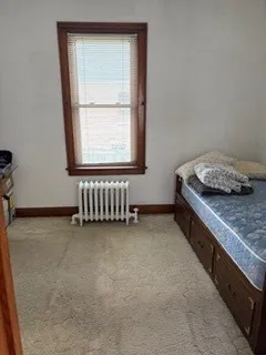 a kitchen with a stove and a window