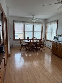 a living room with furniture window and wooden floor