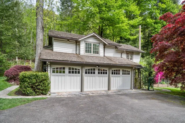 front view of a house with a garden