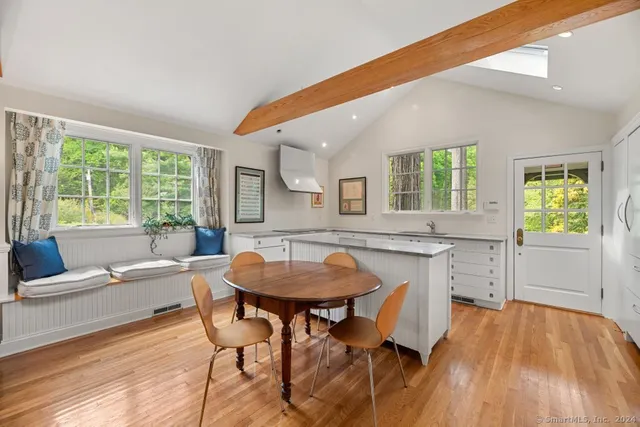a view of a dining room with furniture and a wooden floor