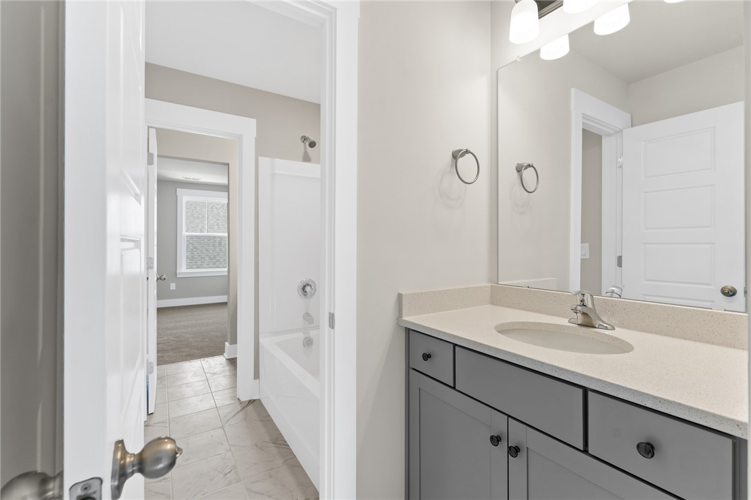 167 Tiger Lily Drive Anderson, SC 29621 - Photo 18 of 34 A well-lit vanity with ample counter space and a modern fixture awaits in this pristine bathroom.