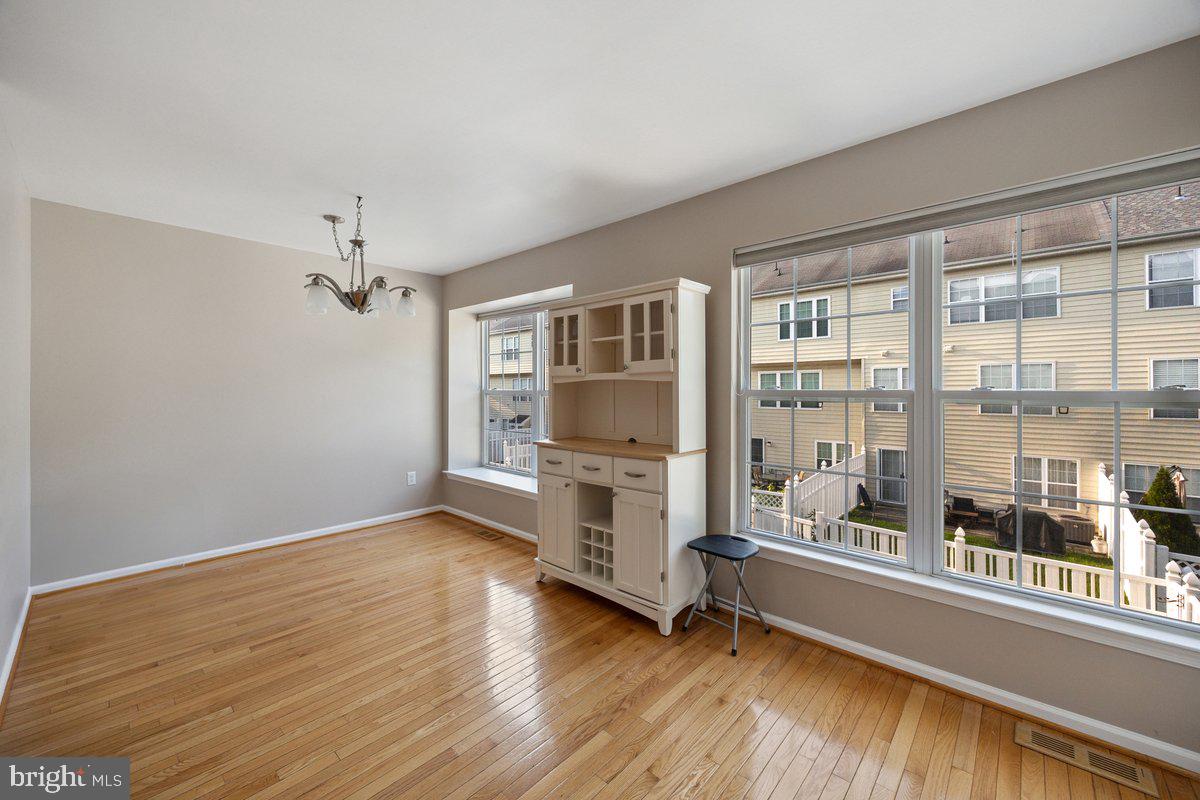 18 Alexandra Court Marlton, NJ 08053 - Photo 12 of 24 wooden floor in an empty room with a window