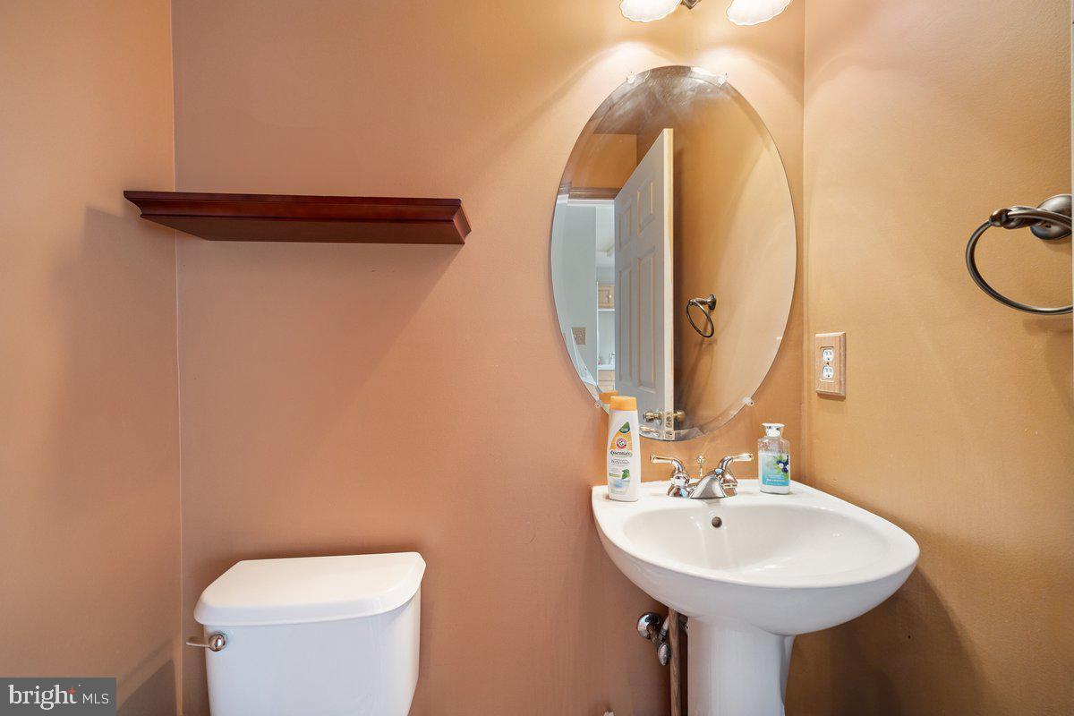 18 Alexandra Court Marlton, NJ 08053 - Photo 14 of 24 a bathroom with a sink a toilet and a mirror