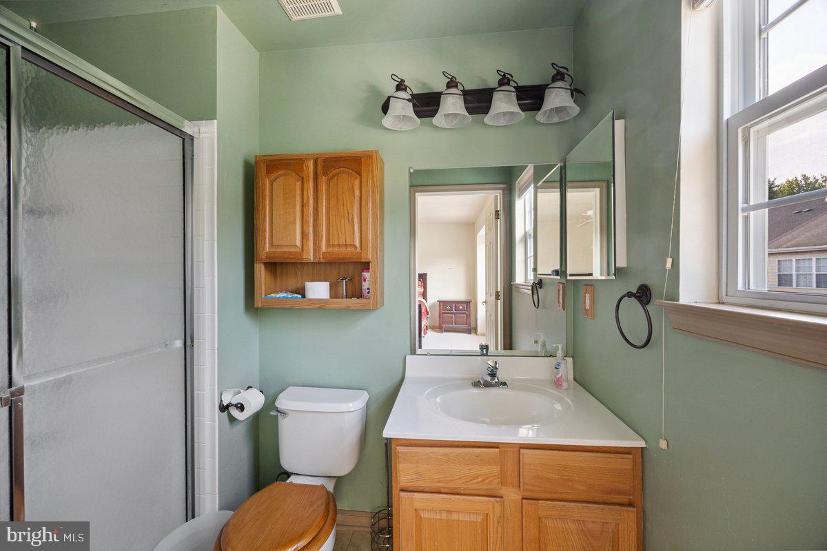 18 Alexandra Court Marlton, NJ 08053 - Photo 18 of 24 a bathroom with a sink toilet and mirror