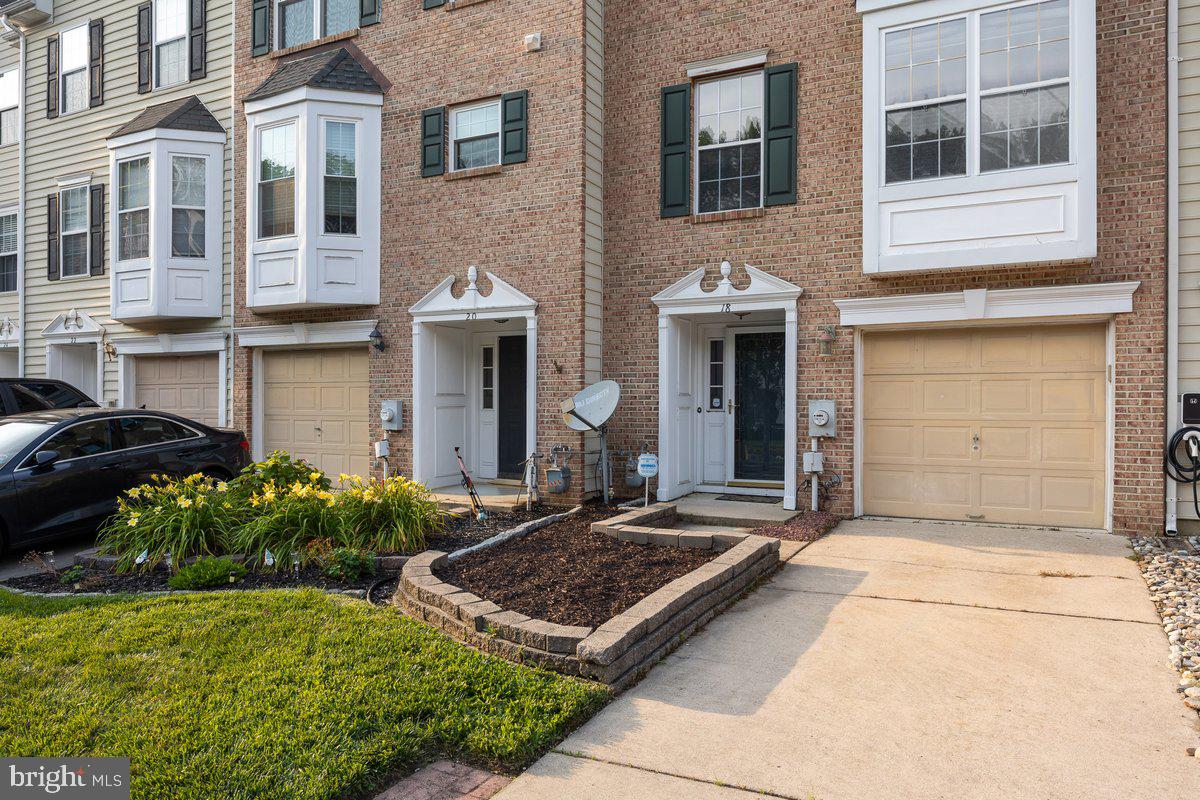 18 Alexandra Court Marlton, NJ 08053 - Photo 2 of 24 a front view of a house with a yard