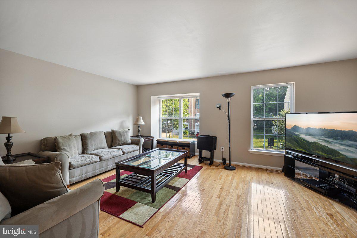 18 Alexandra Court Marlton, NJ 08053 - Photo 7 of 24 a living room with furniture a window and a flat screen tv