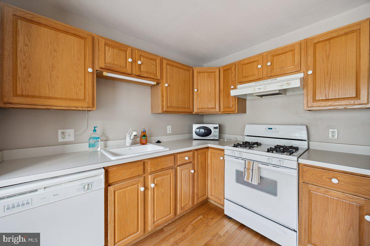 18 Alexandra Court Marlton, NJ 08053 - Photo 10 of 24 a kitchen with cabinets appliances a sink and a counter space