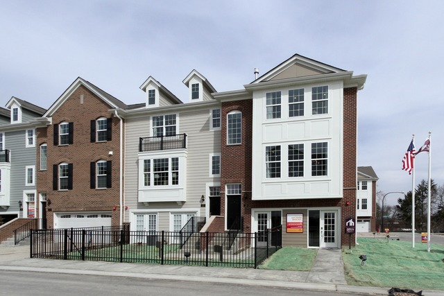 21 Marcel Lane Schaumburg, IL 60194 - Photo 1 of 22 a front view of a residential apartment building with a yard