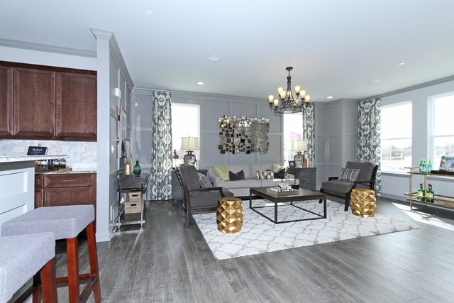 21 Marcel Lane Schaumburg, IL 60194 - Photo 2 of 22 a living room with furniture and a chandelier