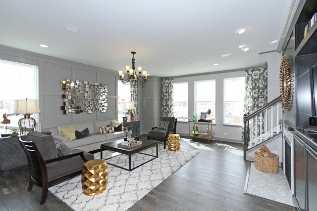 21 Marcel Lane Schaumburg, IL 60194 - Photo 4 of 22 a living room with furniture chandelier and a flat screen tv