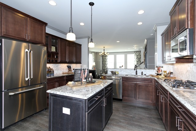 21 Marcel Lane Schaumburg, IL 60194 - Photo 10 of 22 a kitchen with a stove sink and refrigerator