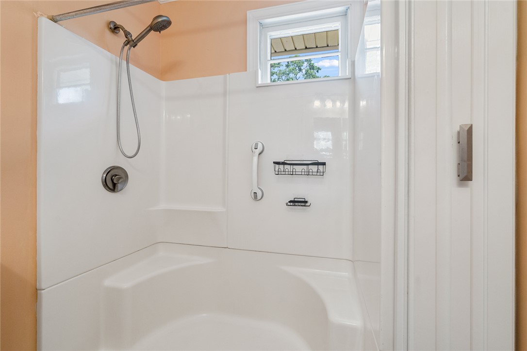 1509 869 Anderson, SC 29621 - Photo 26 of 45 A spacious shower with convenient grab bars and a small window for natural light.