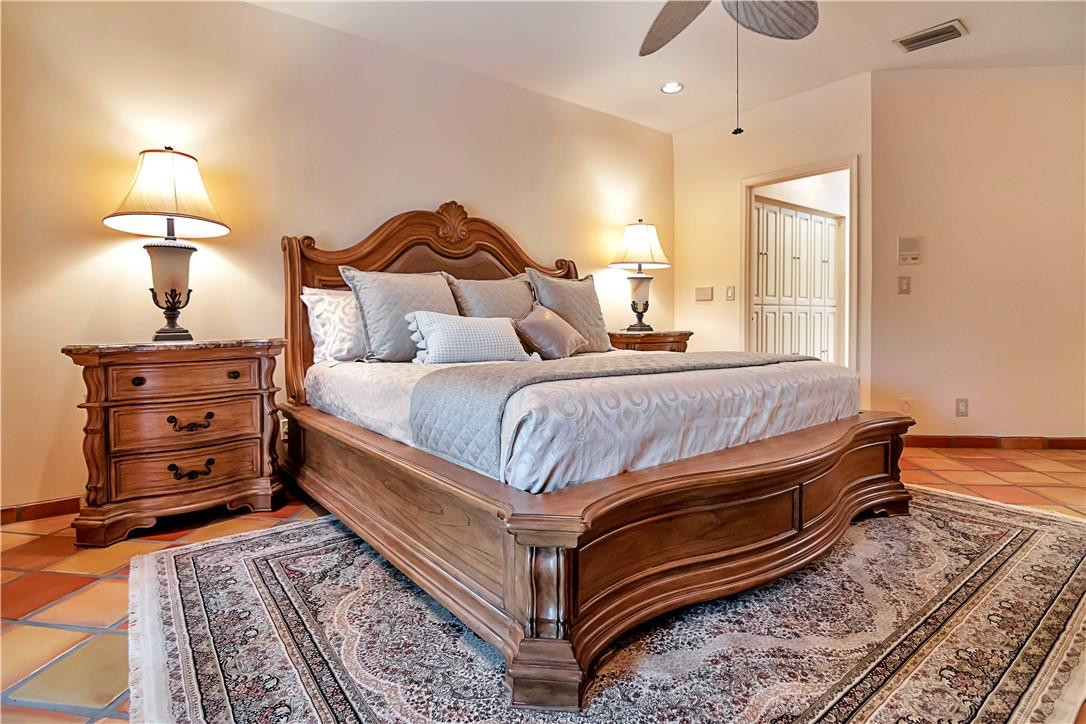 6396 Via Rosa Boca Raton, FL 33433 - Photo 17 of 30 a bedroom with a bed and wooden floor