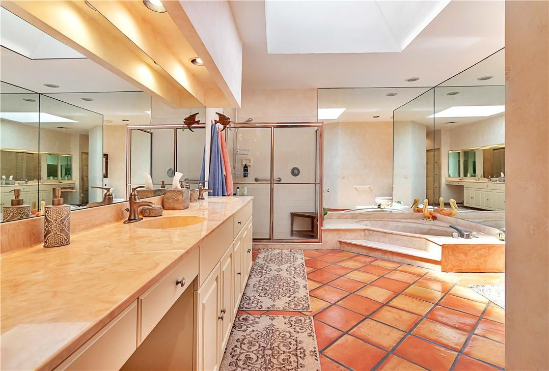 6396 Via Rosa Boca Raton, FL 33433 - Photo 18 of 30 a large white bathroom with a large tub shower and sink