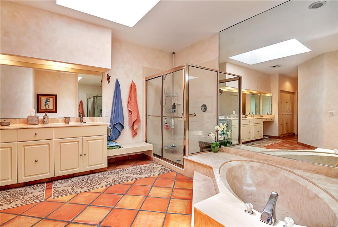 6396 Via Rosa Boca Raton, FL 33433 - Photo 19 of 30 a spacious bathroom with a mirror a bathtub and shower
