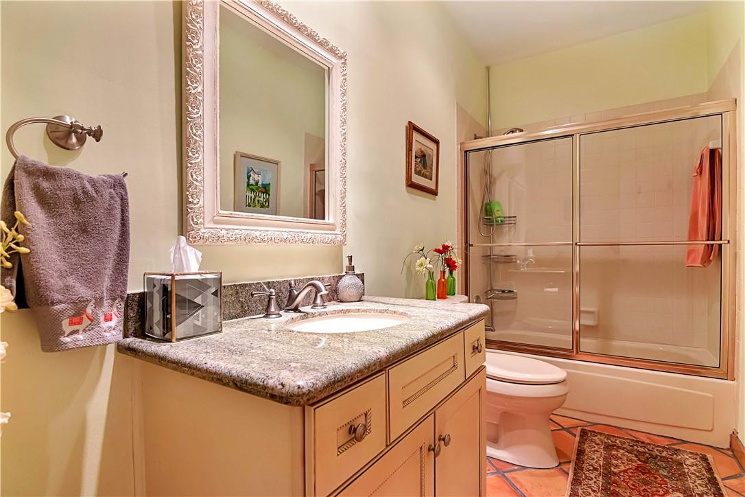 6396 Via Rosa Boca Raton, FL 33433 - Photo 22 of 30 a bathroom with a granite countertop sink toilet and shower