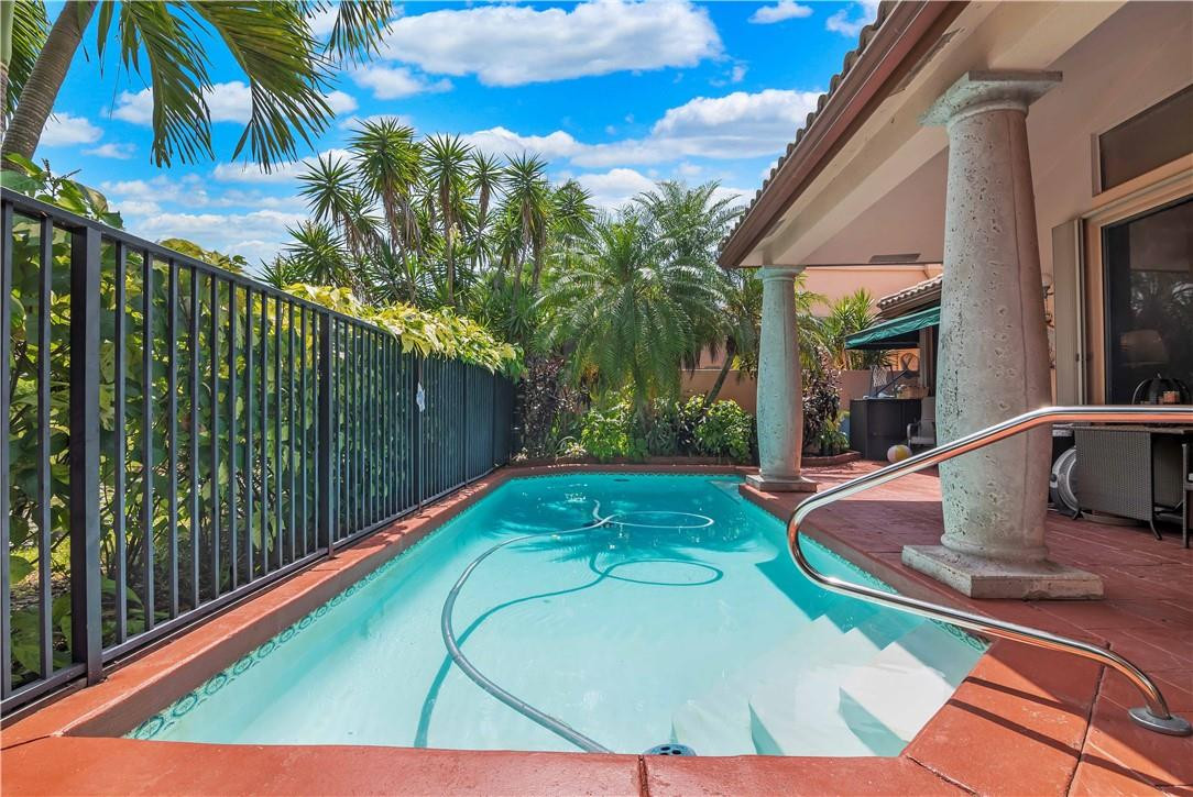 6396 Via Rosa Boca Raton, FL 33433 - Photo 23 of 30 a view of a backyard with swimming pool