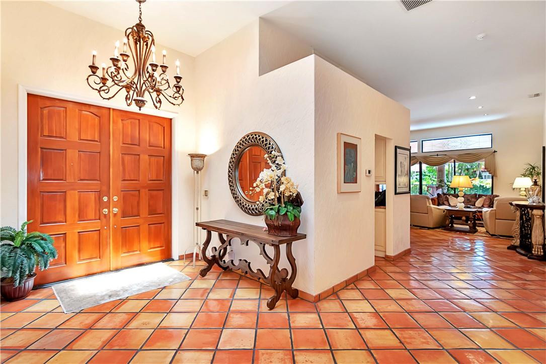 6396 Via Rosa Boca Raton, FL 33433 - Photo 4 of 30 a living room with furniture a table and a potted plant