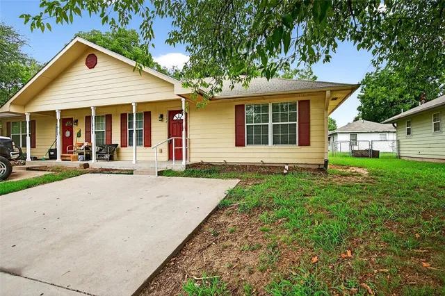 front view of a house with a yard