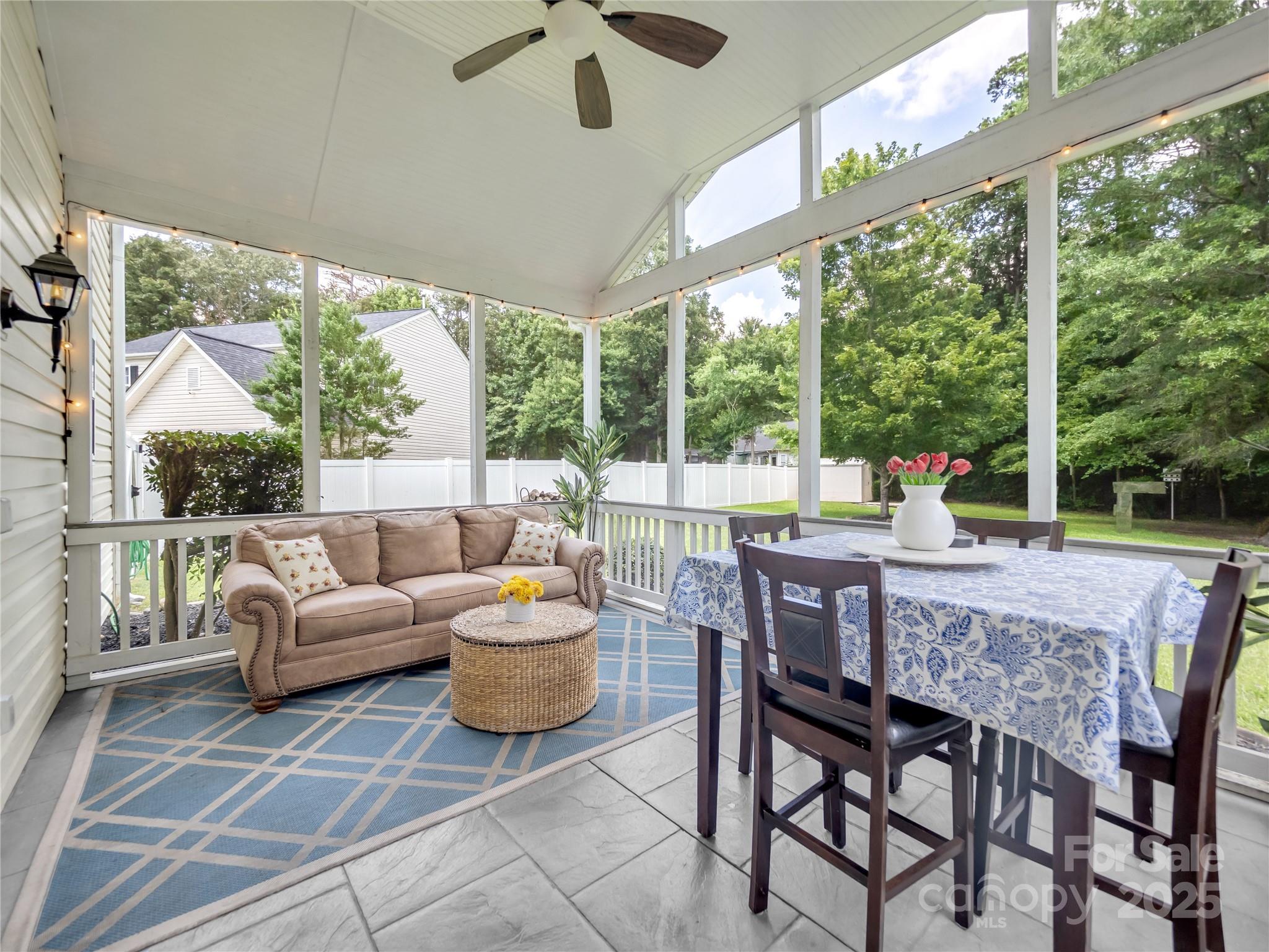 4113 Edgeview Drive Indian Trail, NC 28079 - Photo 11 of 28 a view of a patio with a table chairs and a backyard