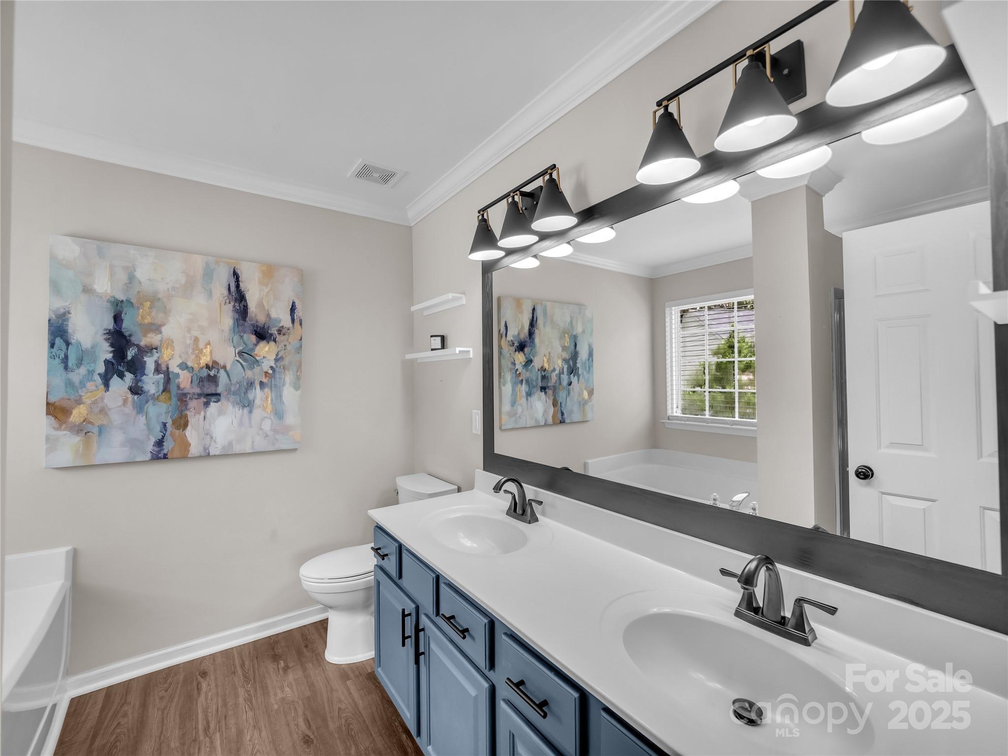 4113 Edgeview Drive Indian Trail, NC 28079 - Photo 17 of 28 a bathroom with a double vanity sink and a mirror