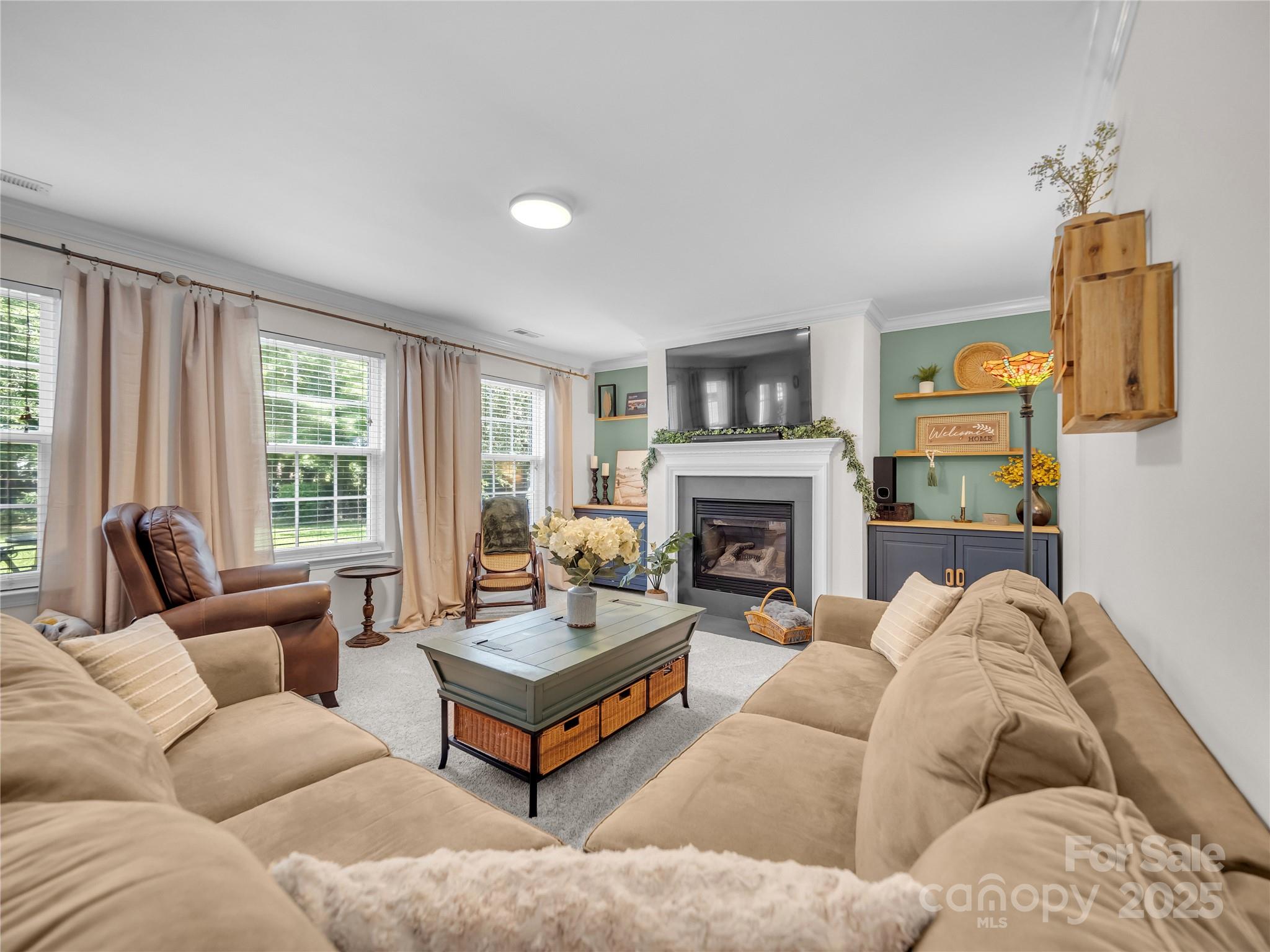 4113 Edgeview Drive Indian Trail, NC 28079 - Photo 6 of 28 a living room with furniture and a fireplace