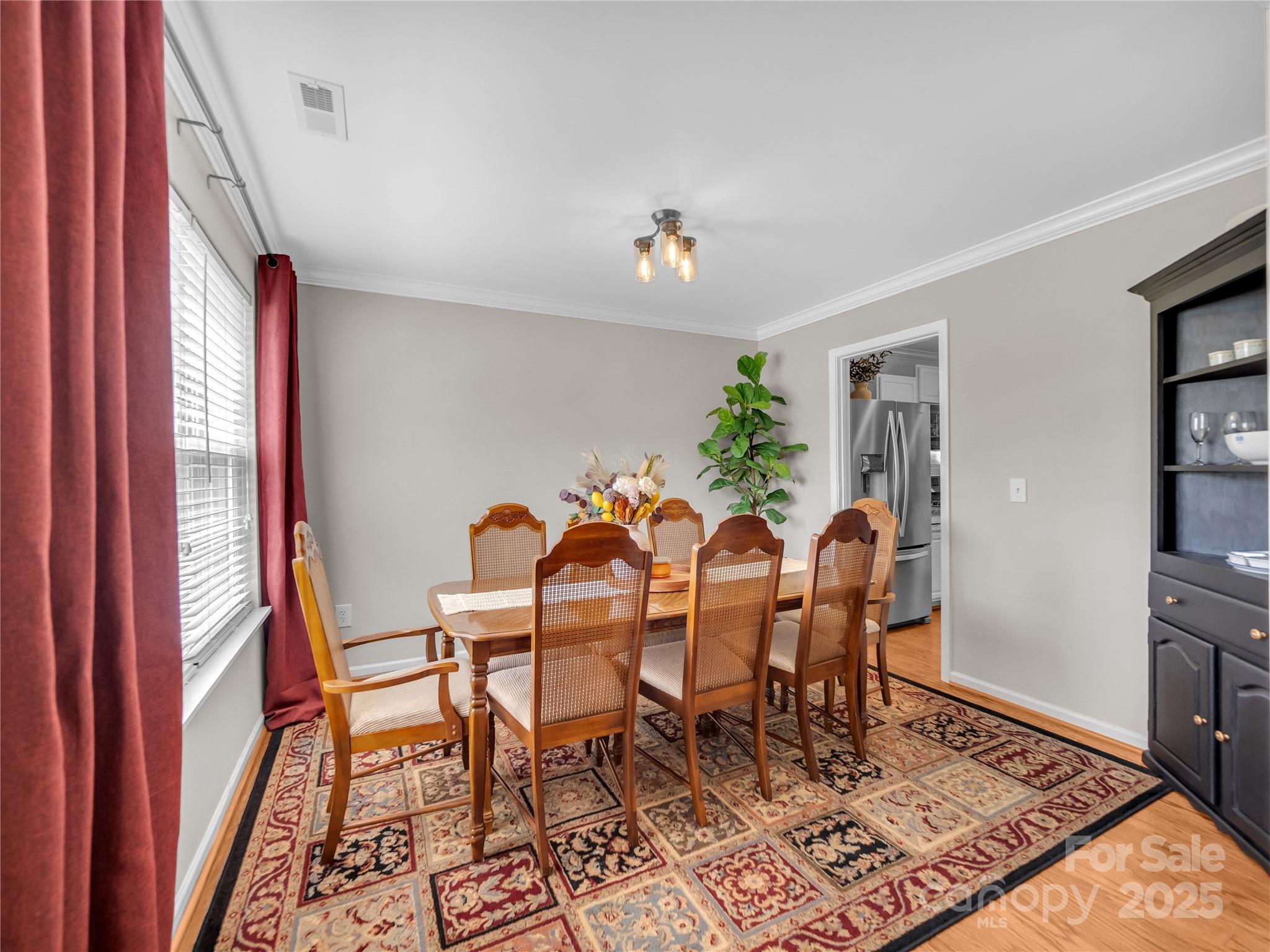 4113 Edgeview Drive Indian Trail, NC 28079 - Photo 8 of 28 a view of a dining room with furniture window and wooden floor
