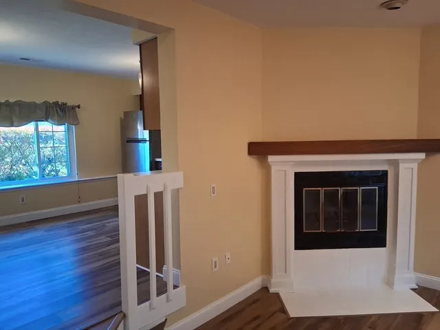 a view of an entryway with wooden floor