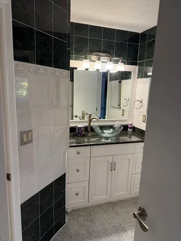 a bathroom with a sink and a mirror