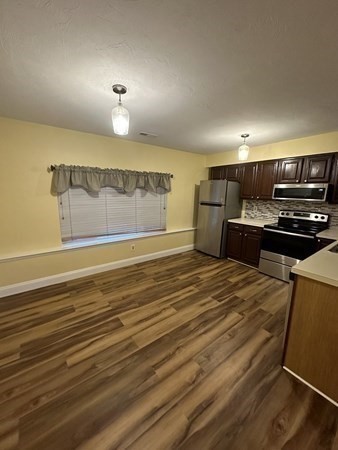 191 Tall Oaks Drive, Unit C Weymouth, MA 02190 - Photo 3 of 24 a view of kitchen and wooden floor