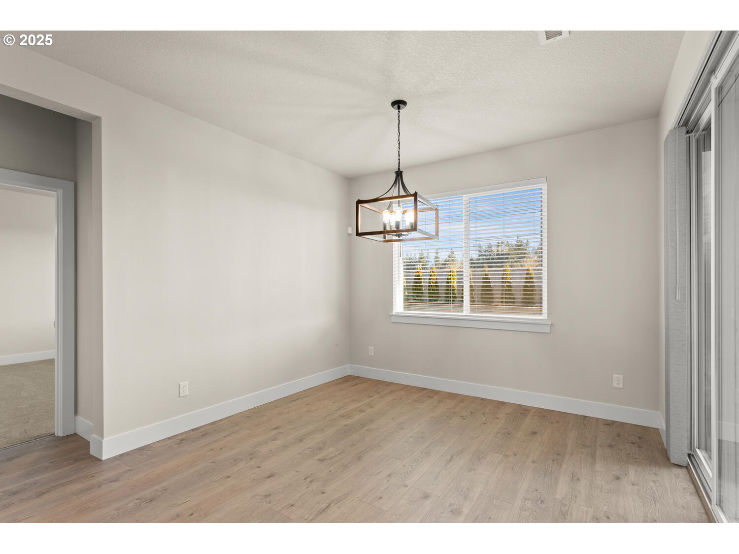 1100 North 44th Place Ridgefield, WA 98642 - Photo 13 of 29 a view of wooden floor and windows in a room