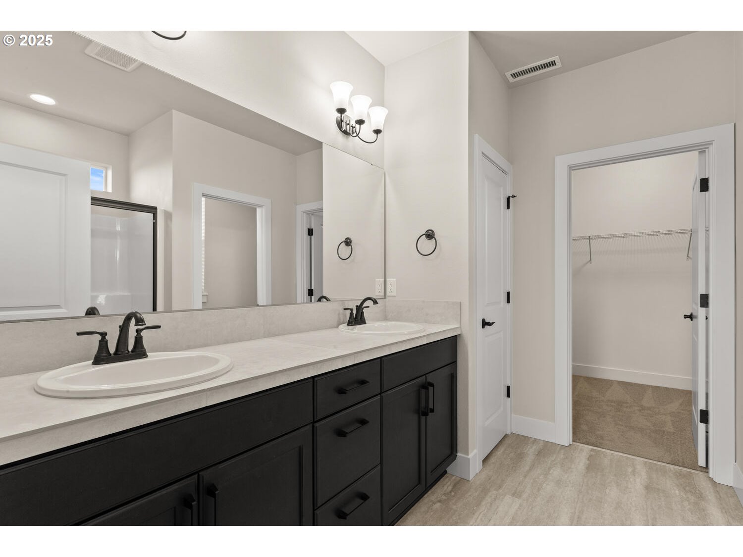 1100 North 44th Place Ridgefield, WA 98642 - Photo 15 of 29 a bathroom with a double vanity sink and a mirror