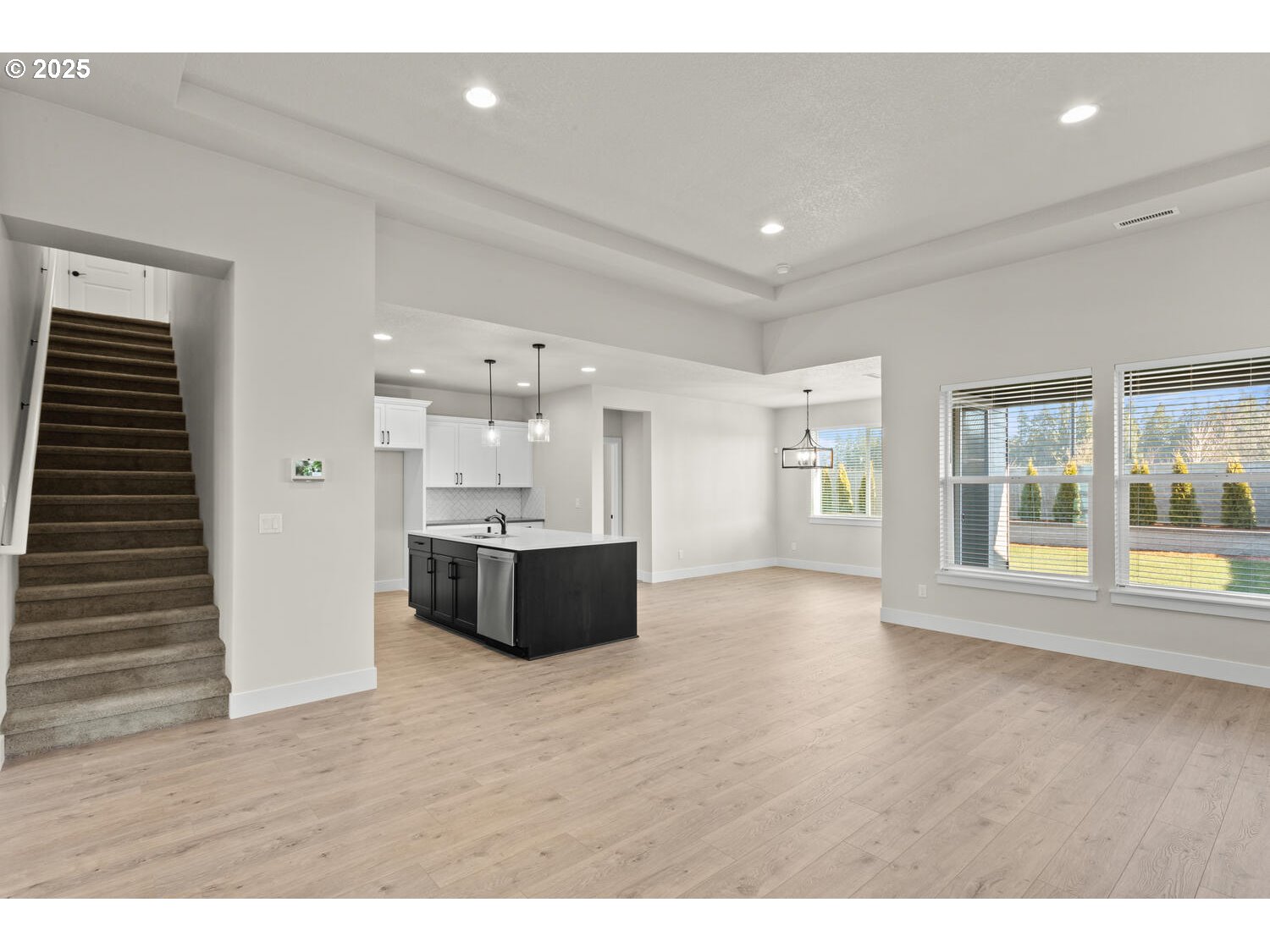 1100 North 44th Place Ridgefield, WA 98642 - Photo 17 of 29 a large room with a large window and wooden floors