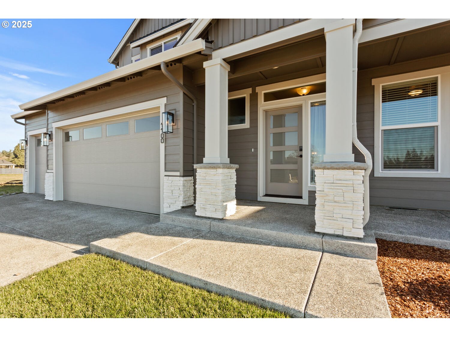 1100 North 44th Place Ridgefield, WA 98642 - Photo 2 of 29 a front view of a house with a garage