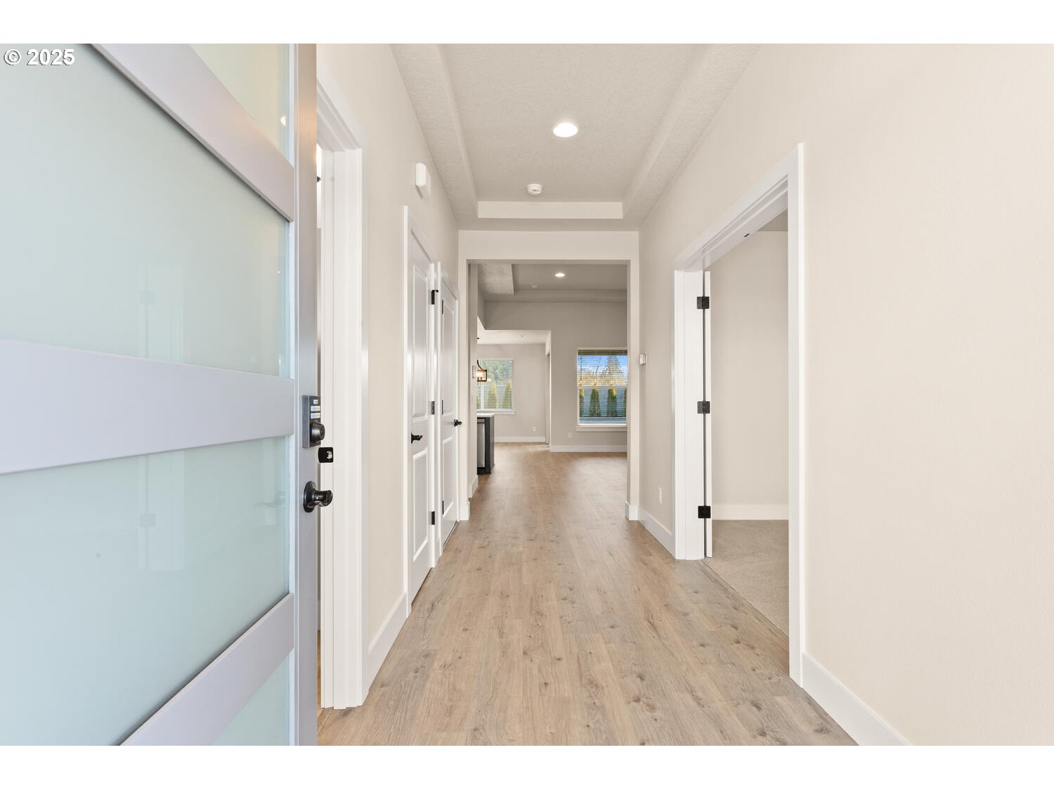 1100 North 44th Place Ridgefield, WA 98642 - Photo 3 of 29 a view of a hallway with wooden floor