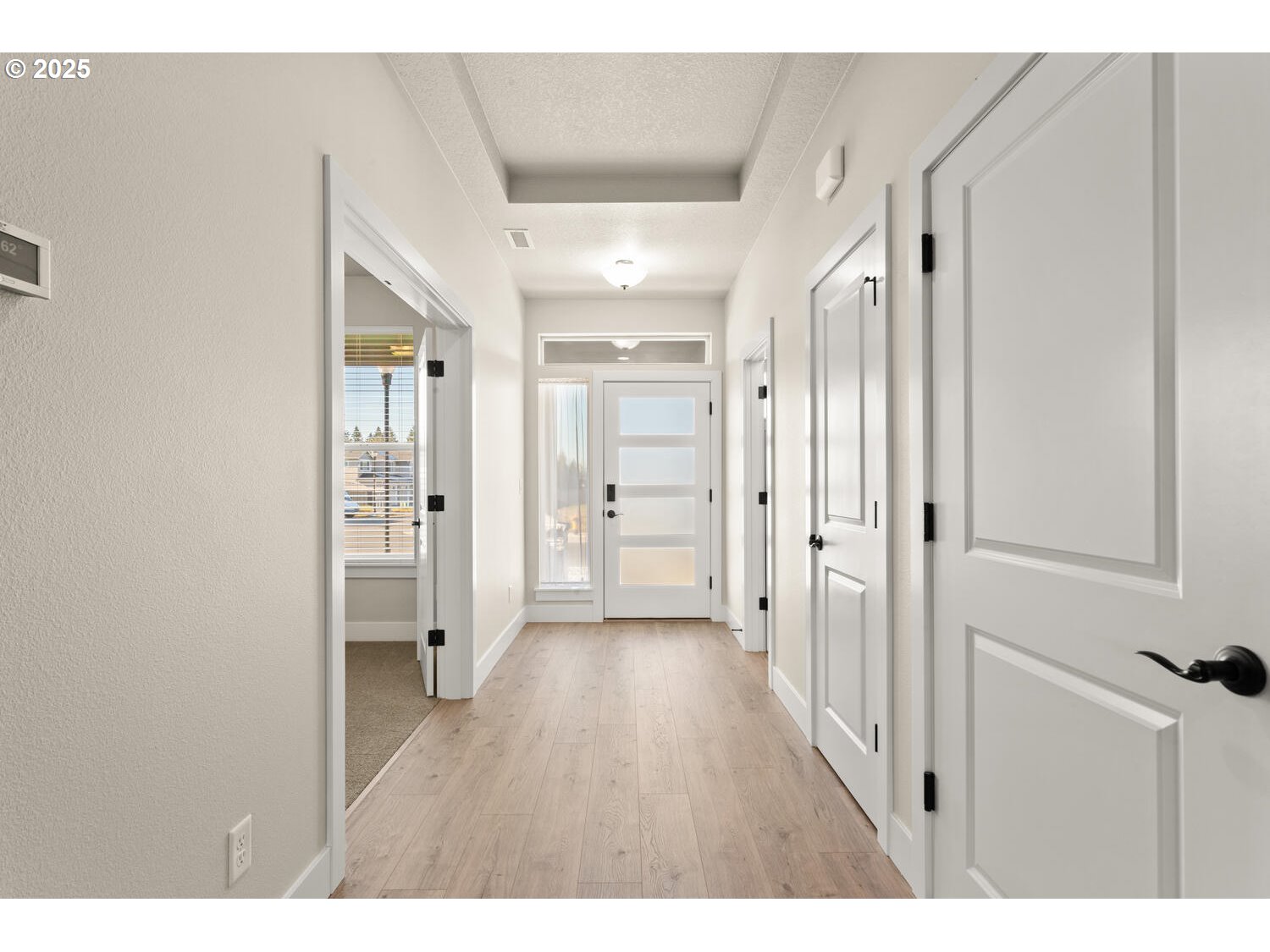 1100 North 44th Place Ridgefield, WA 98642 - Photo 4 of 29 a view of a hallway with wooden floor