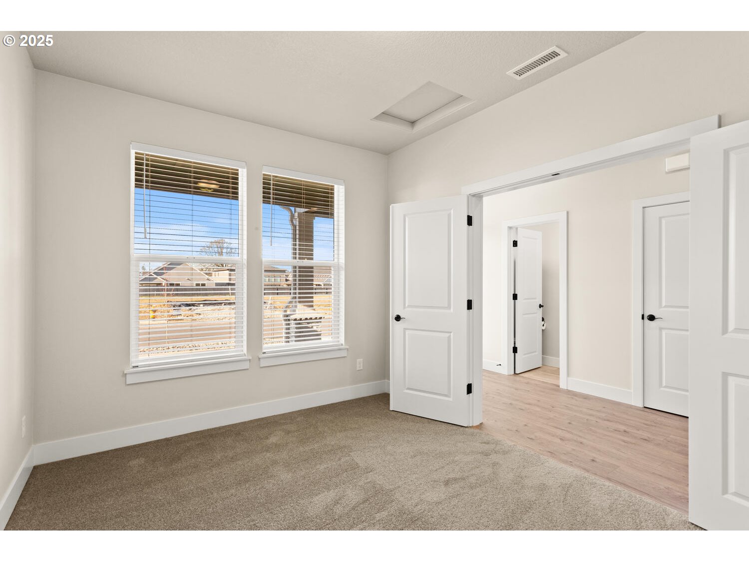 1100 North 44th Place Ridgefield, WA 98642 - Photo 5 of 29 a view of an empty room with wooden floor and window