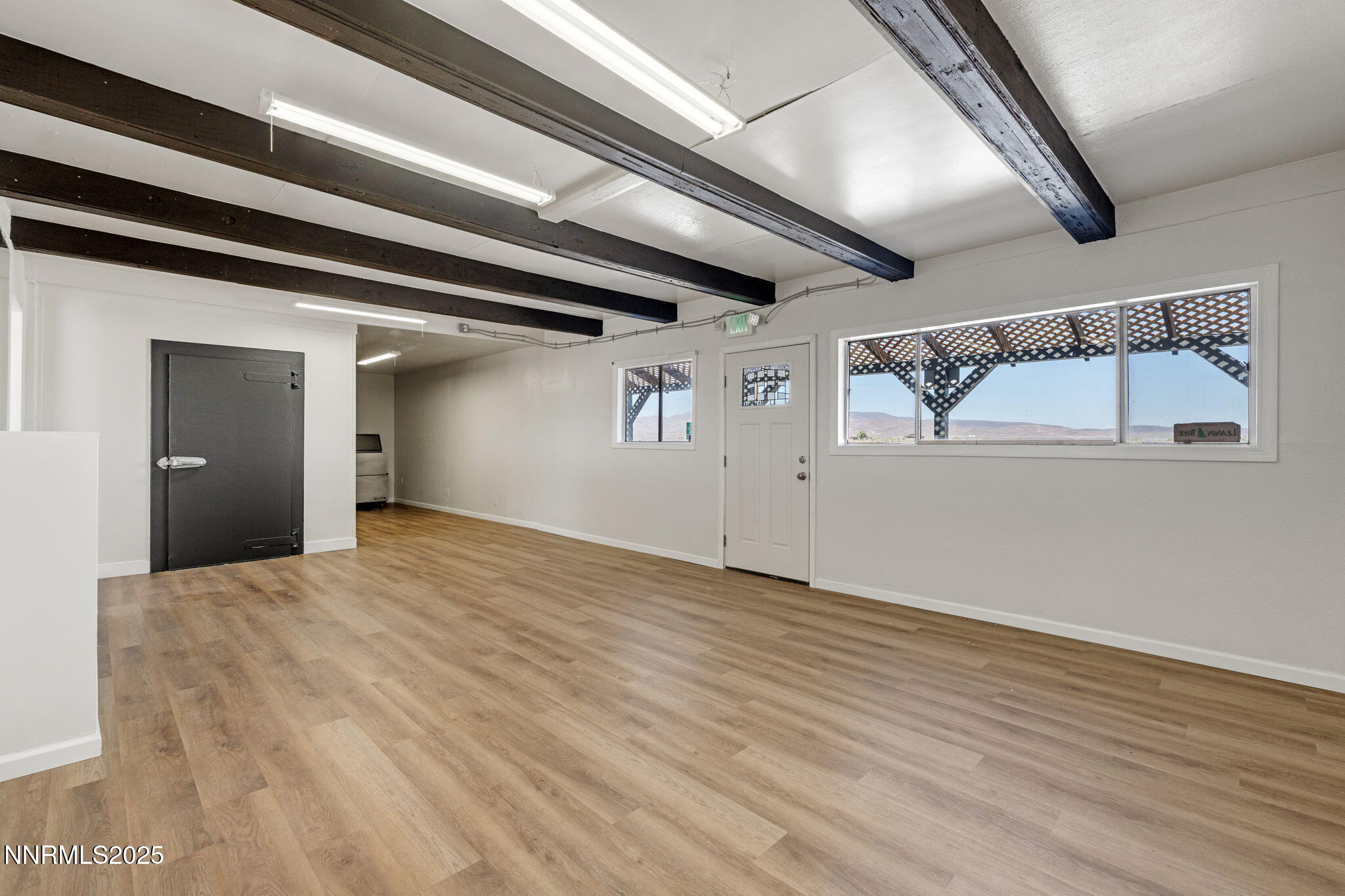 2725 East Fir Street Silver Springs, NV 89429 - Photo 13 of 56 a view of empty room with wooden floor