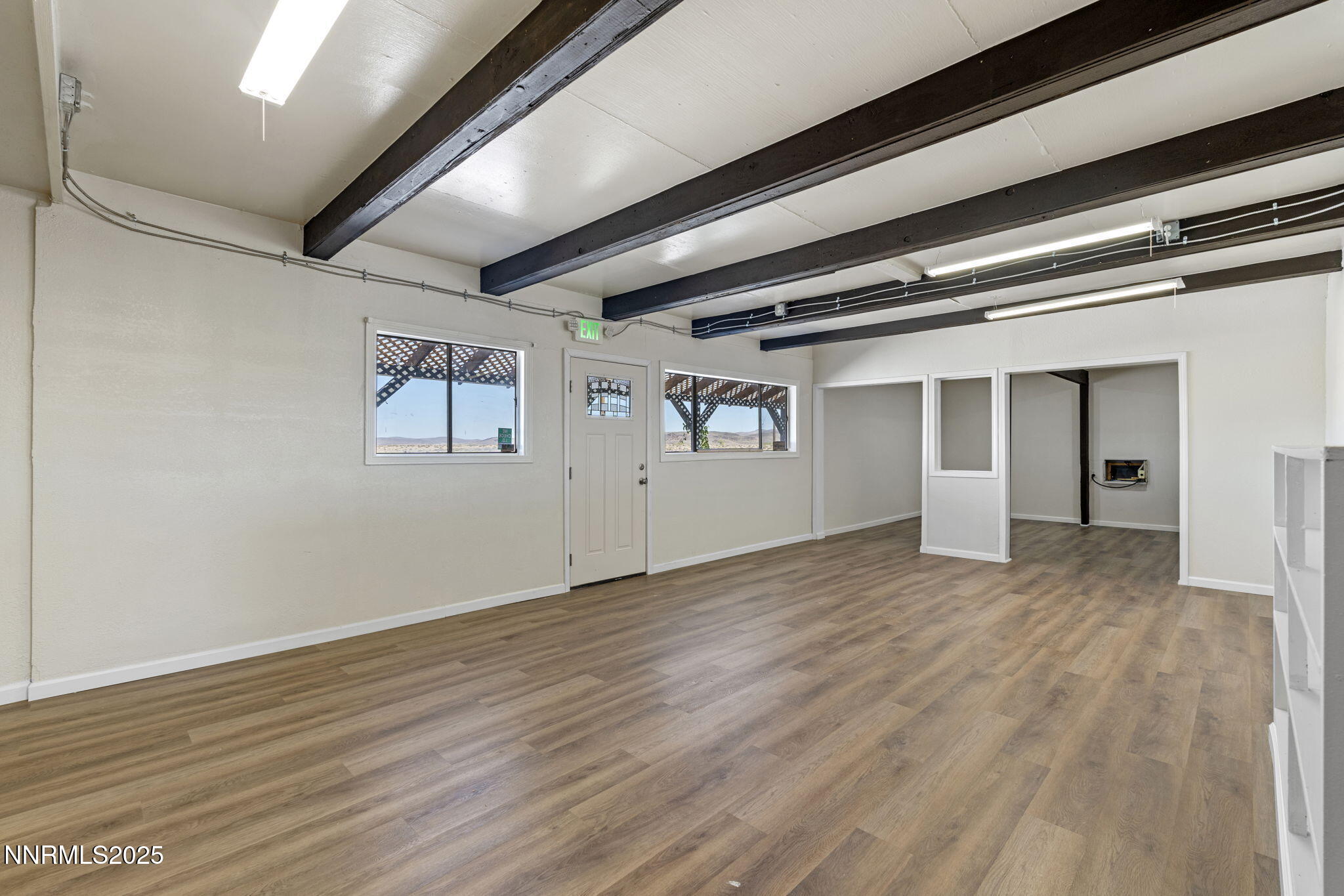 2725 East Fir Street Silver Springs, NV 89429 - Photo 14 of 56 a view of empty room with wooden floor