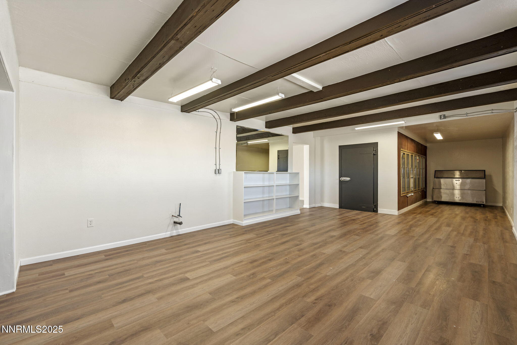 2725 East Fir Street Silver Springs, NV 89429 - Photo 20 of 56 a view of an empty room and wooden floor
