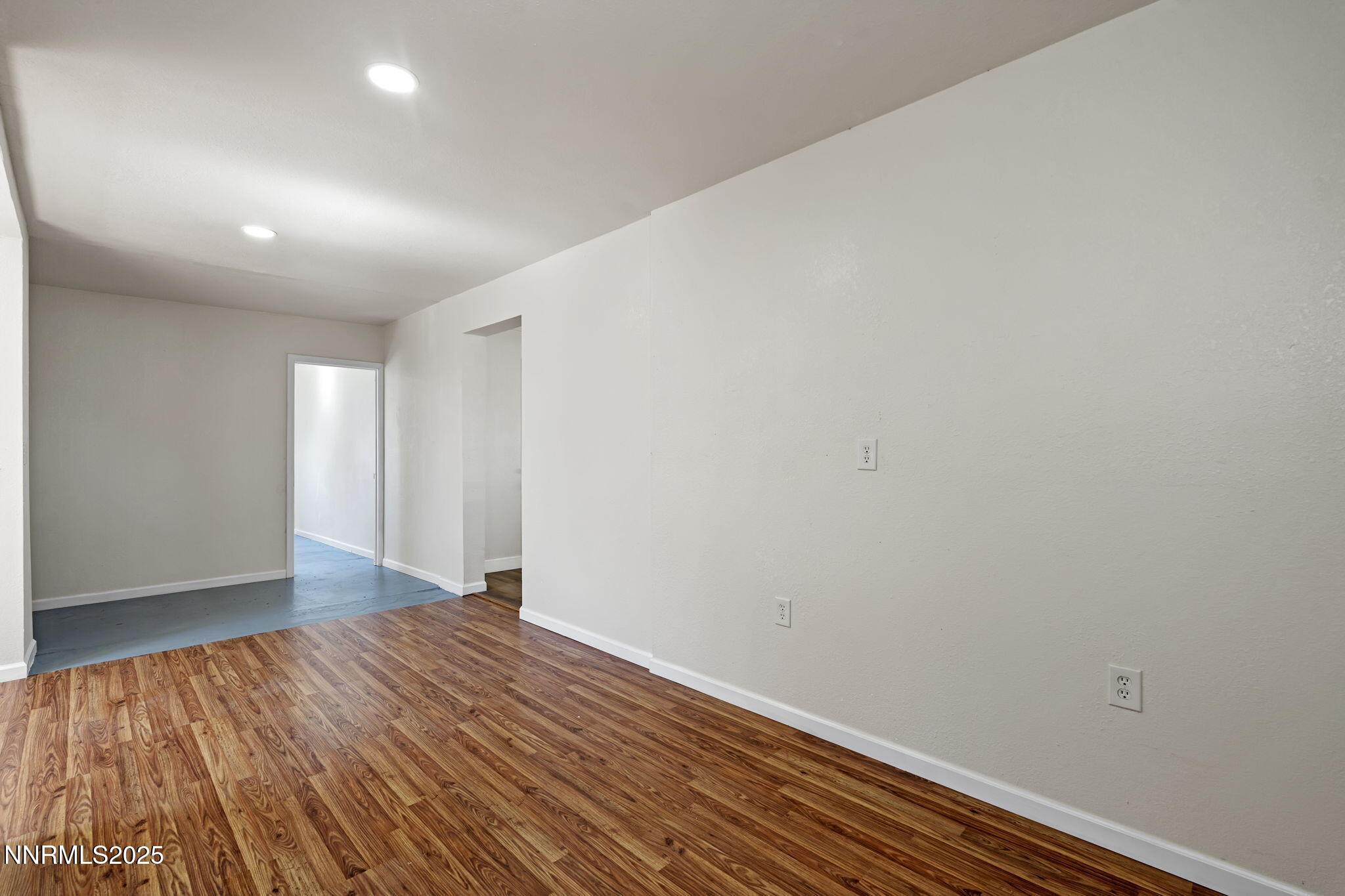 2725 East Fir Street Silver Springs, NV 89429 - Photo 26 of 56 a view of an empty room with wooden floor